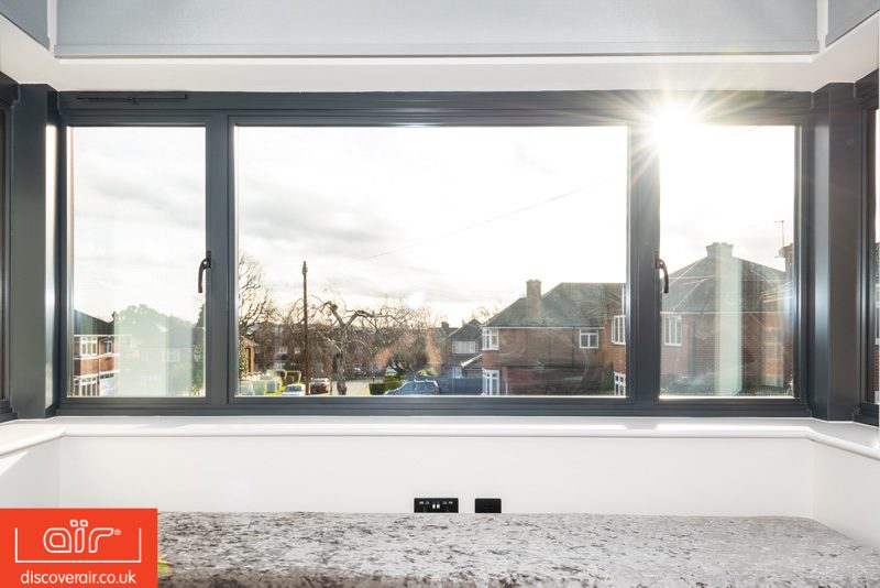 Large aluminium bay window with side opening casement windows